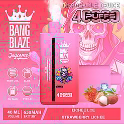 Promotional image of a pink disposable vaping device branded as 'Bang Blaze Joycome' with 40ml capacity, 650mAh battery, featuring a mesh coil, slide mechanism, oil tank, and Type-C charging, displayed alongside fresh strawberries, lychee fruit, and ice cubes on a bright pink backdrop.